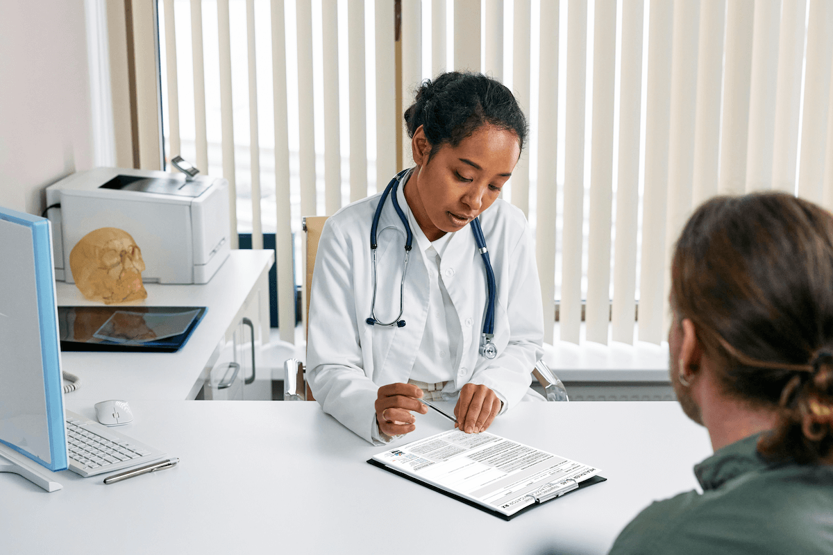 A doctor looking at a Healthier Texas Wellness Navigator resource